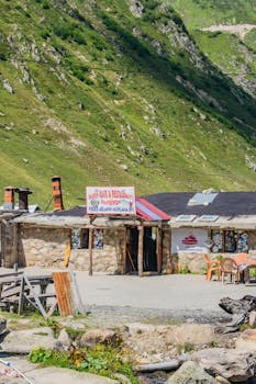 Explore a rustic stone café set against Rize's stunning mountain backdrop, epitomizing Turkish countryside charm.